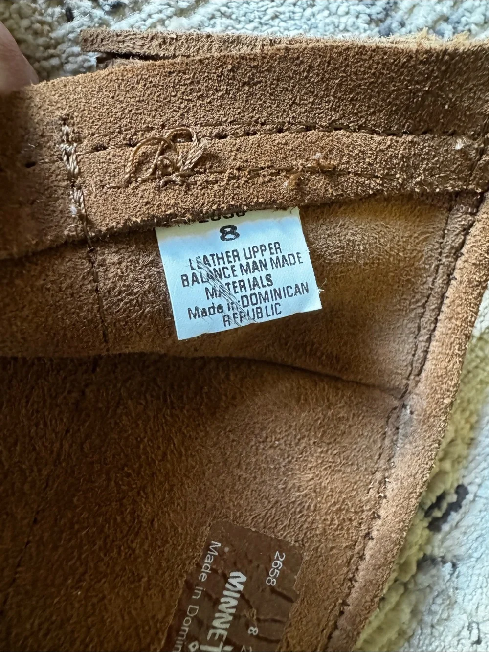 Minnetonka Tan Suede Moccasin Label Close-Up